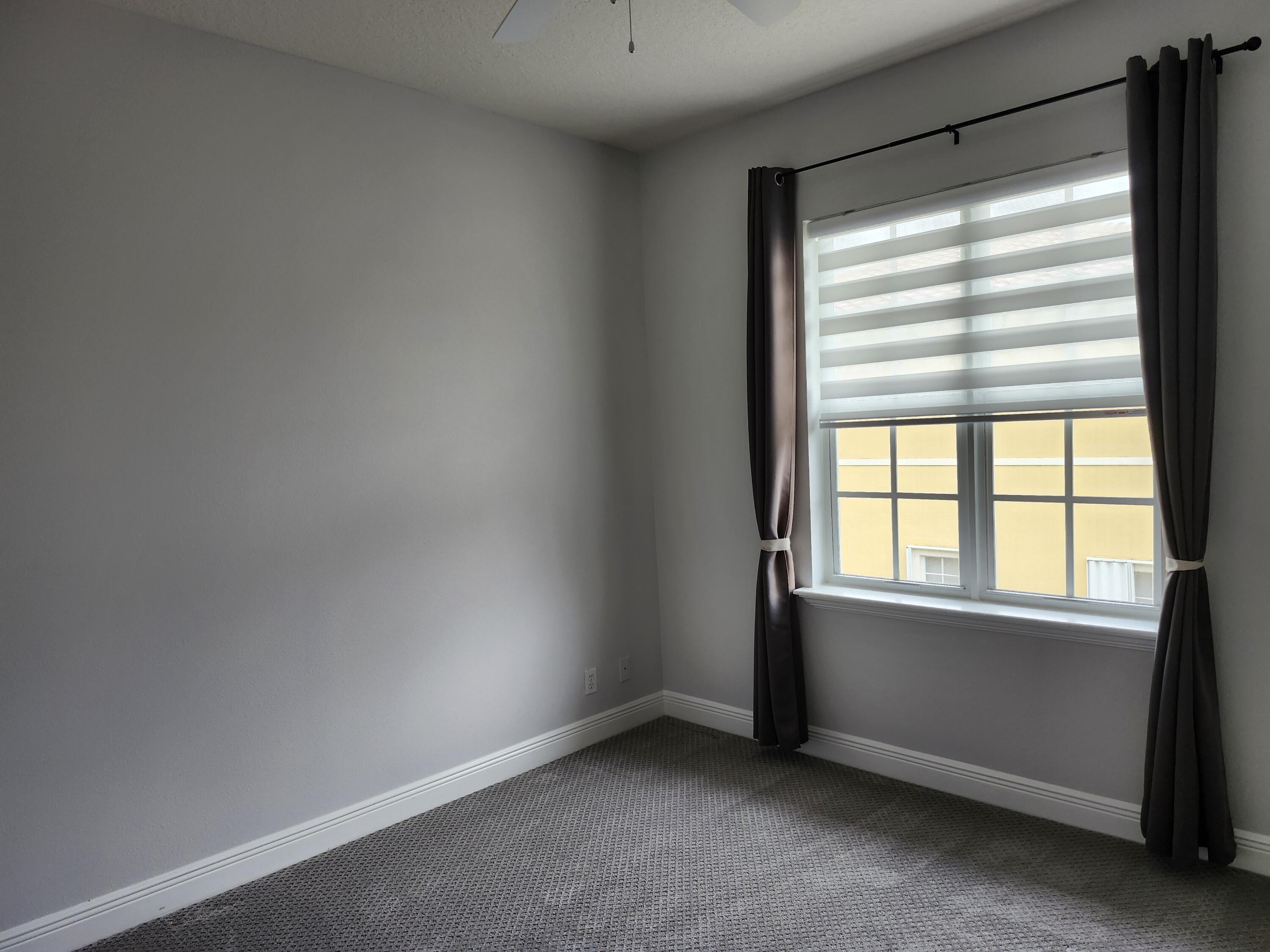 108 Morning Dew Circle Jupiter, FL 33458 - Photo 29 of 46 an empty room with a window