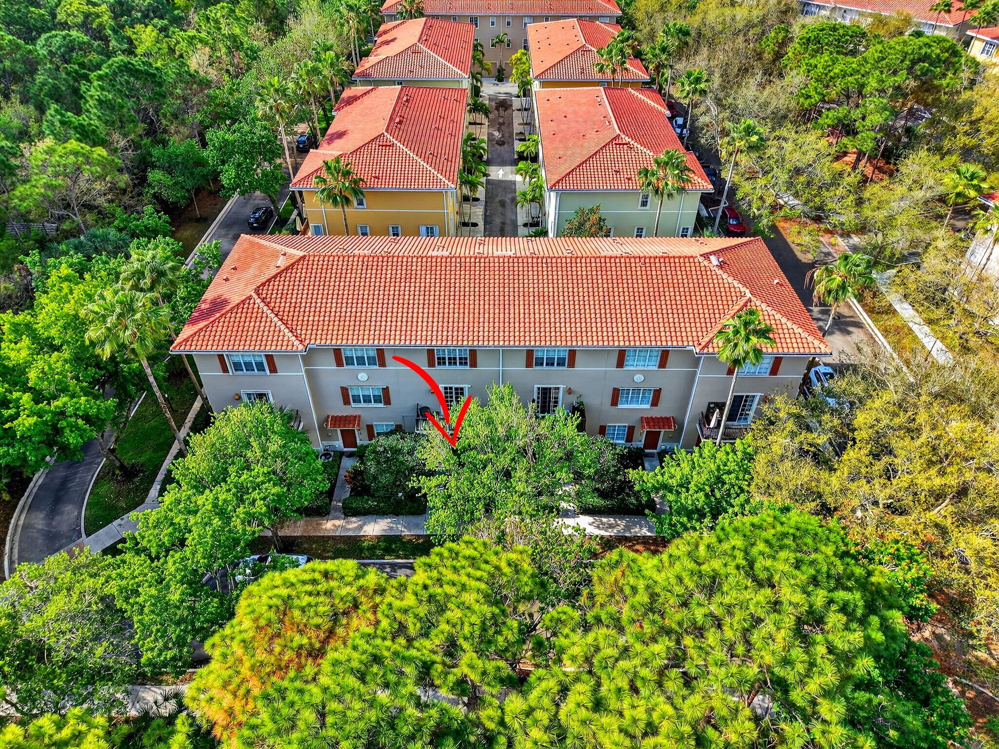 108 Morning Dew Circle Jupiter, FL 33458 - Photo 32 of 46 a view of a multi story residential apartment building in the city