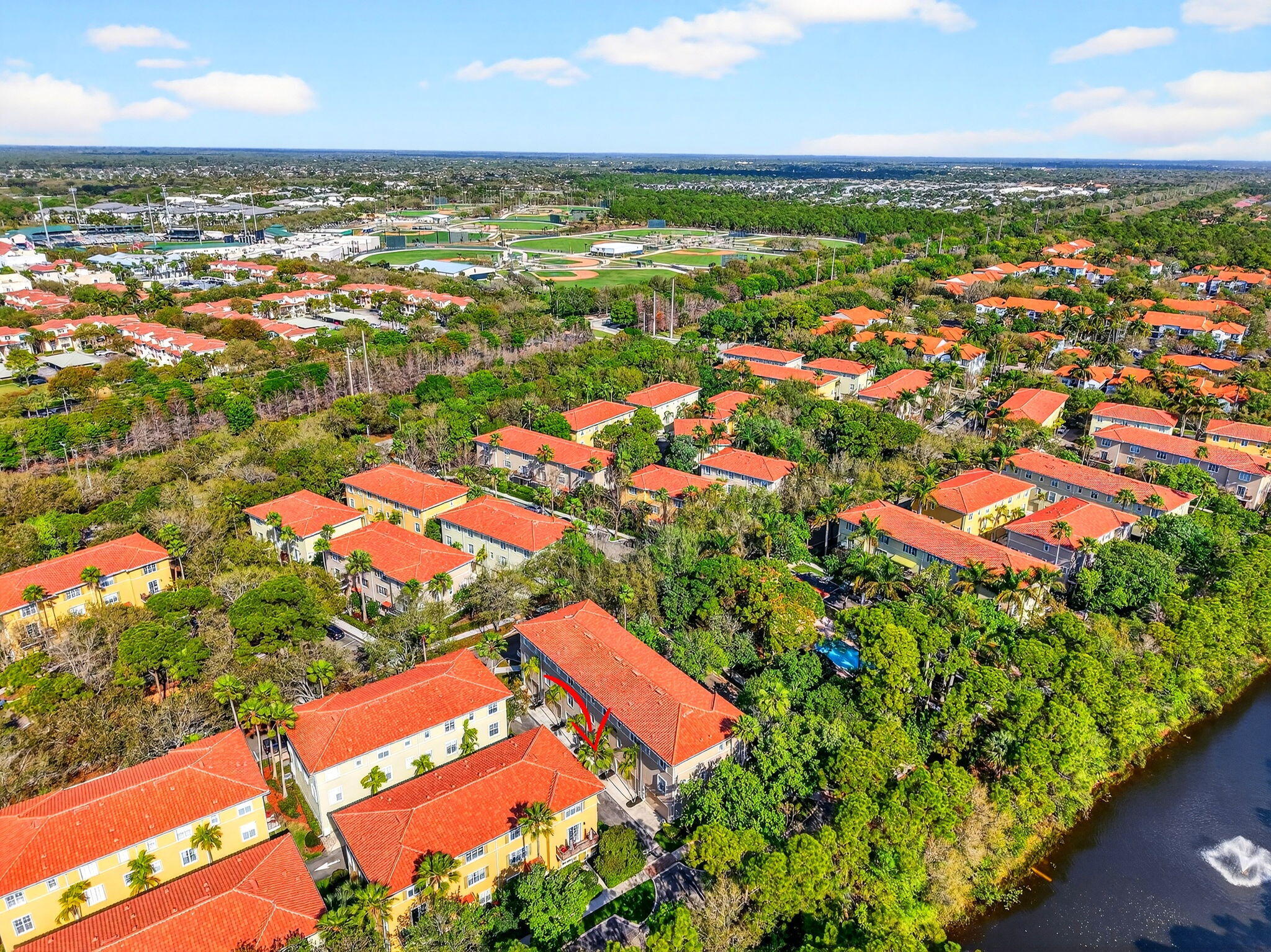 108 Morning Dew Circle Jupiter, FL 33458 - Photo 39 of 46 an aerial view of residential houses with outdoor space and trees