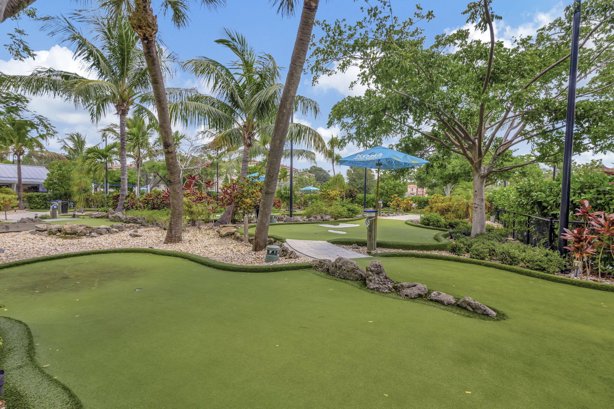 108 Morning Dew Circle Jupiter, FL 33458 - Photo 44 of 46 a view of a swimming pool with a garden