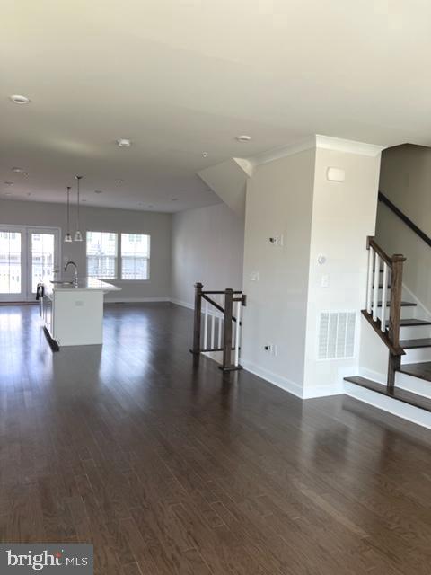 619 Quarry Point Road Malvern, PA 19355 - Photo 11 of 24 a view of an empty room with window and wooden floor