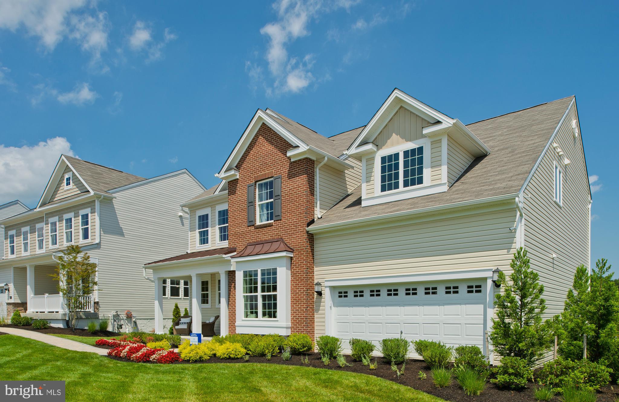 14026 Rolling Pasture Road Boyds, MD 20841 - Photo 2 of 39 a front view of a house with a yard and potted plants