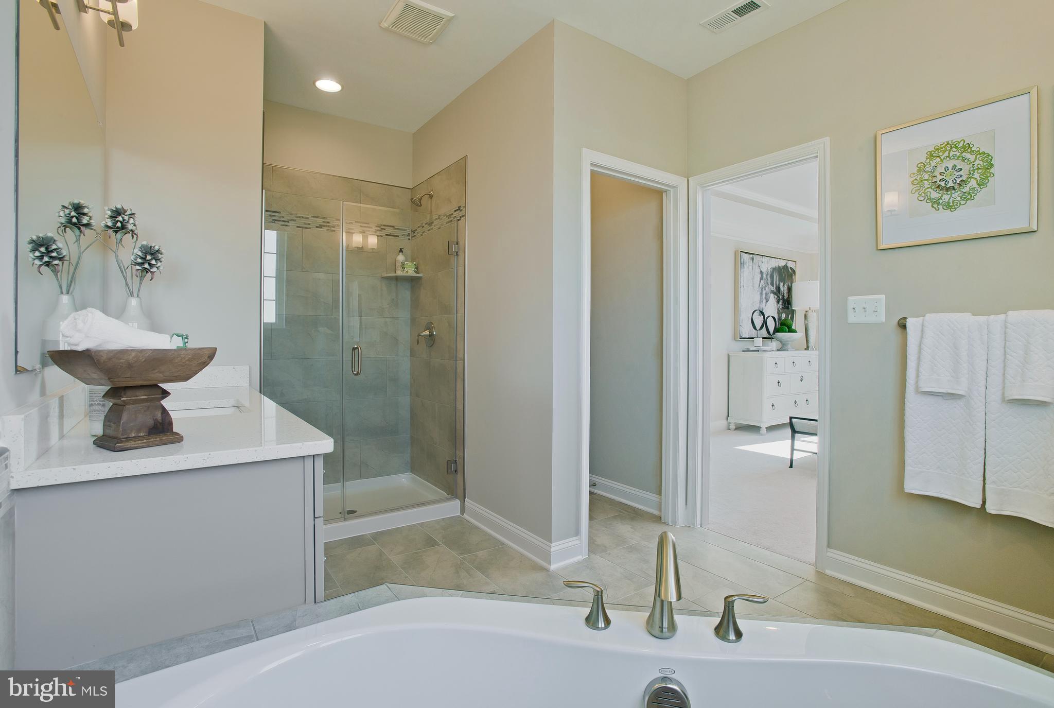 14026 Rolling Pasture Road Boyds, MD 20841 - Photo 22 of 39 a bathroom with a sink a toilet and shower