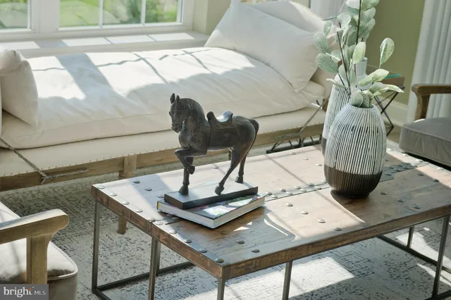 a kitchen with a table chairs and stove