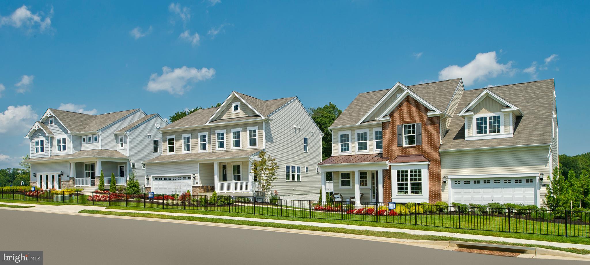 14026 Rolling Pasture Road Boyds, MD 20841 - Photo 33 of 39 a front view of a residential houses with yard and road