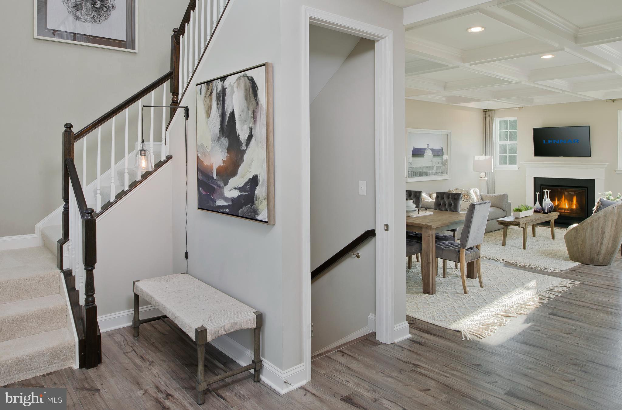 14026 Rolling Pasture Road Boyds, MD 20841 - Photo 4 of 39 a dining room with wooden floor and a hallway