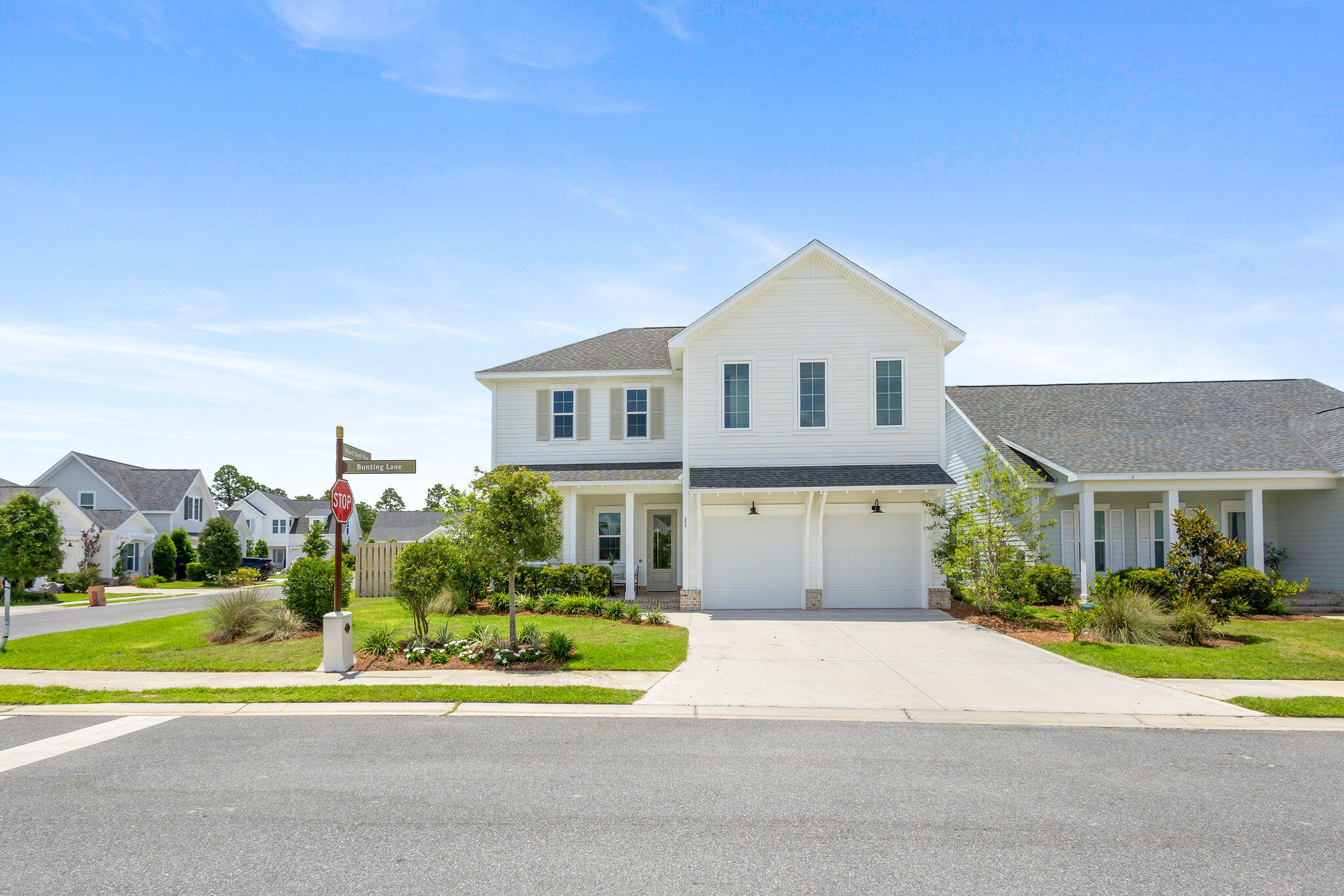 11 Bunting Ln Inlet Beach Inlet Beach, FL 32461 - Photo 48 of 70 a front view of a house with a yard and potted plants