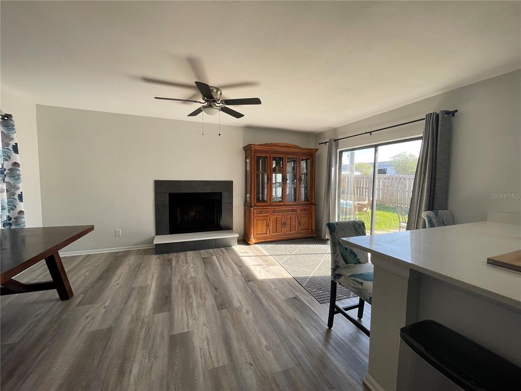 7199 121st Terrace Largo, FL 33773 - Photo 6 of 16 a view of a livingroom with furniture and a fireplace