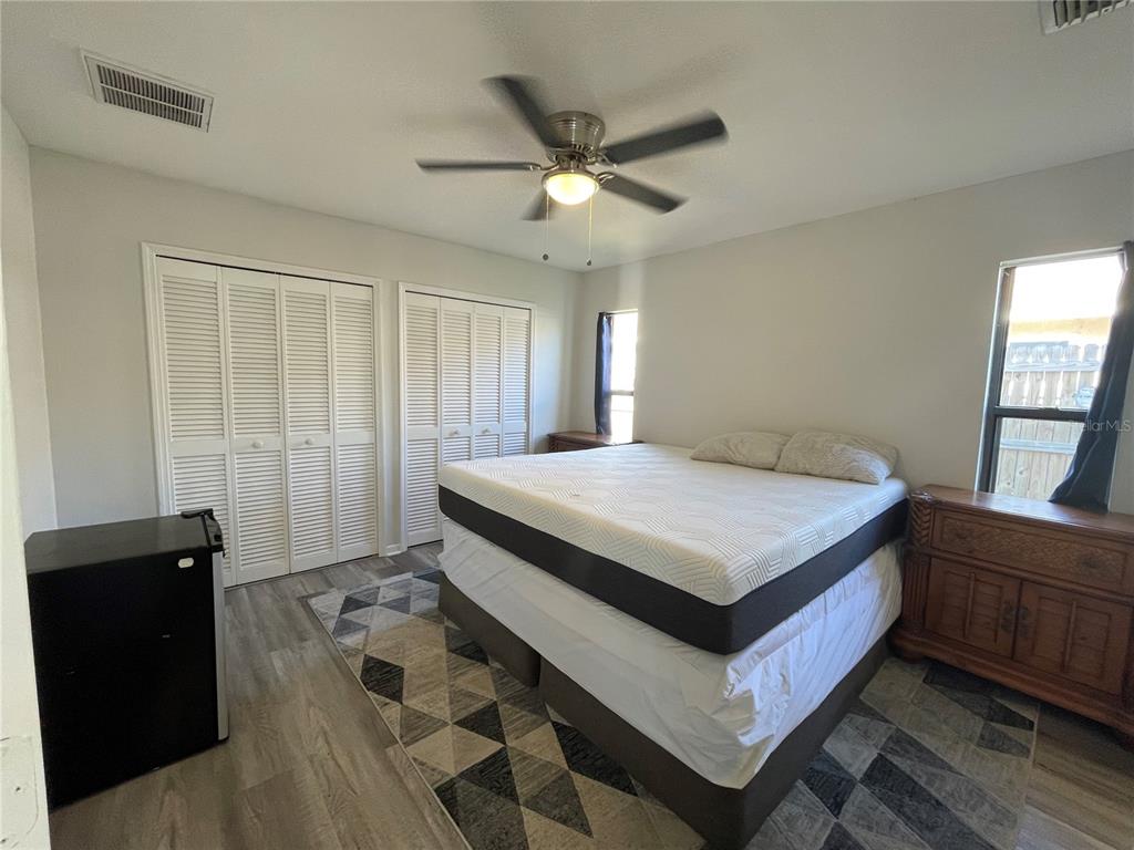 7199 121st Terrace Largo, FL 33773 - Photo 9 of 16 a bedroom with a bed and a dresser