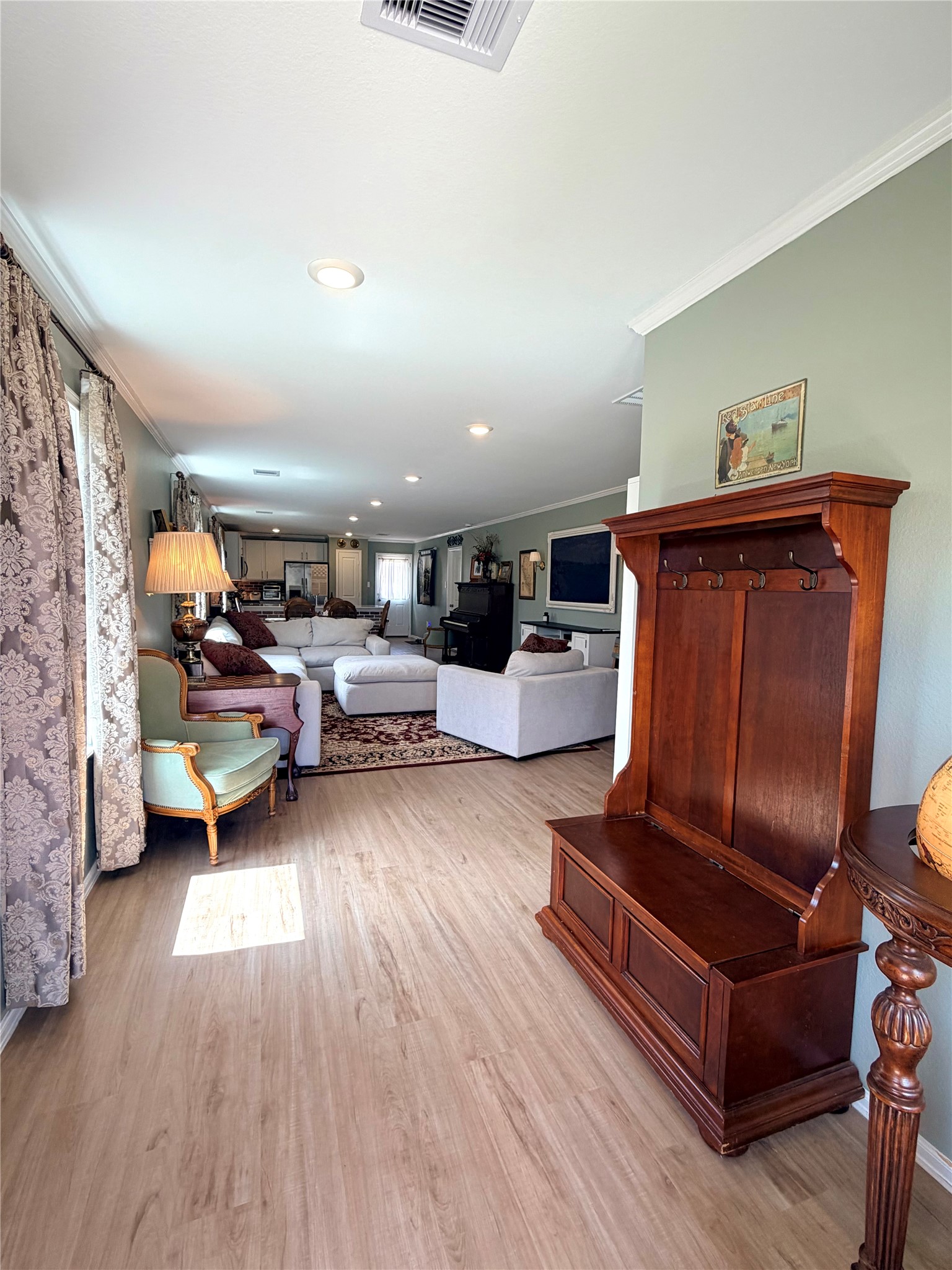 532 Flower Reed Court Magnolia, TX 77354 - Photo 5 of 43 As you enter the home, notice the open layout with light wood LVP flooring, ample natural light, and cozy seating. So warm and welcoming!