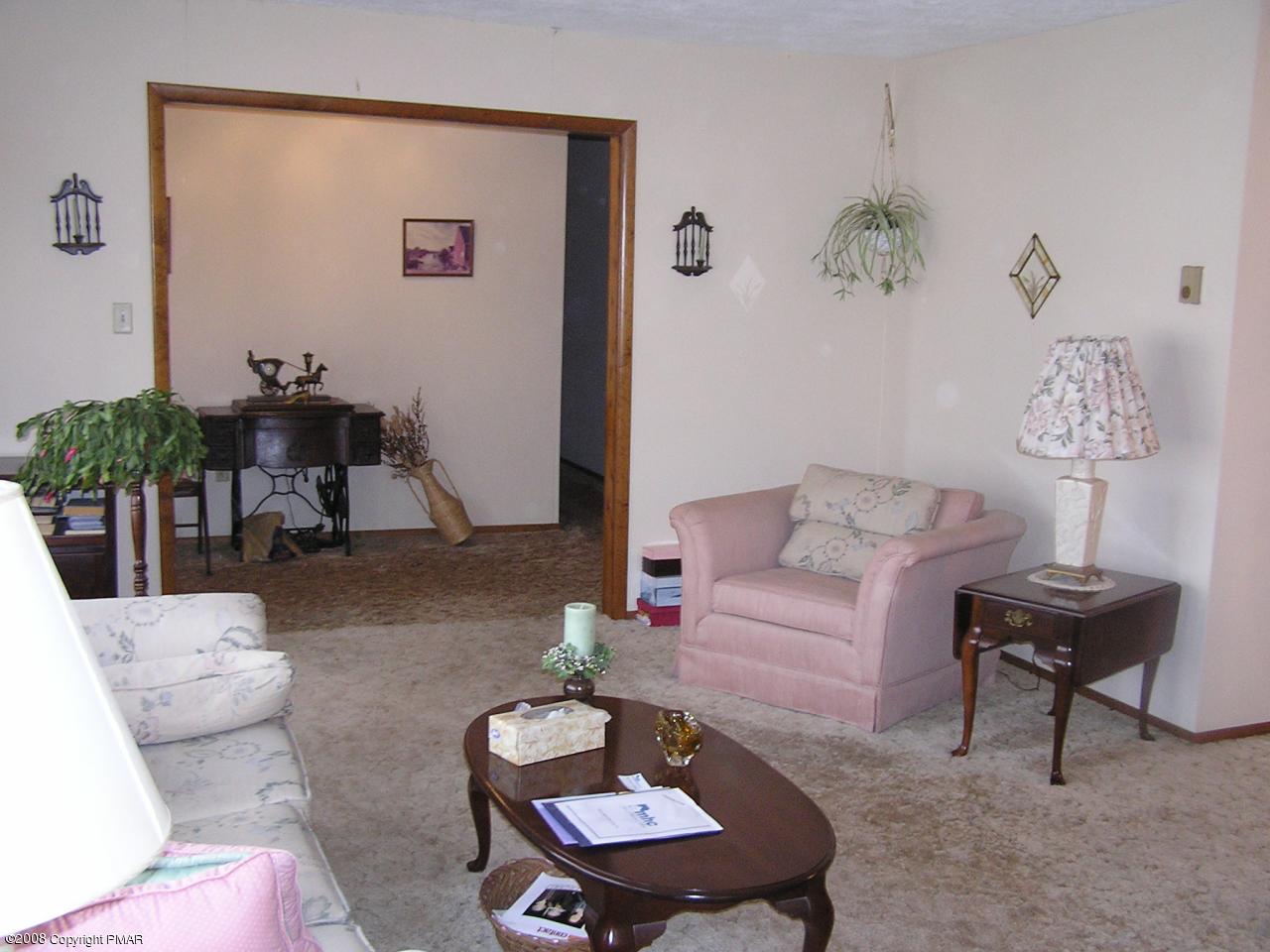 11 Old Post Road Tobyhanna, PA 18466 - Photo 8 of 27 a living room with furniture and a potted plant
