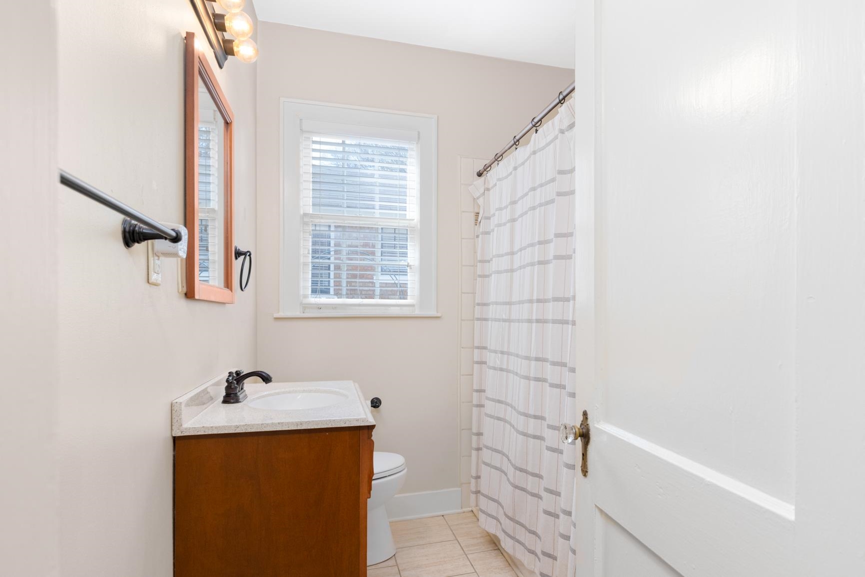 331 Alexander Street Memphis, TN 38111 - Photo 21 of 25 Bathroom with vanity, a shower with shower curtain, and light tile patterned floors