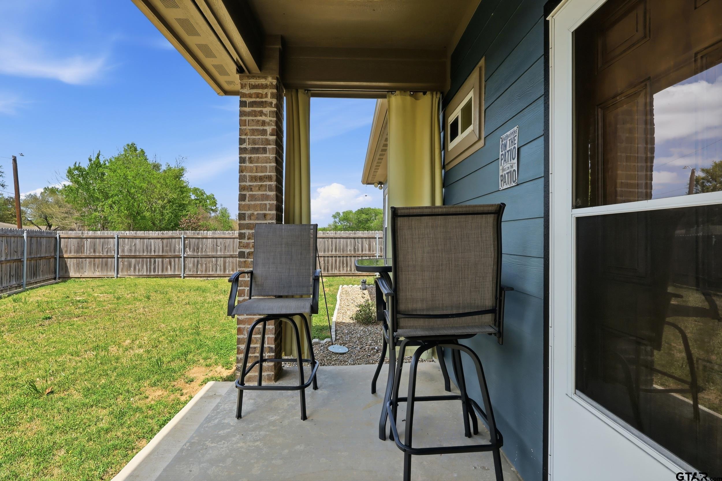 168 Tupelo Street Pittsburg, TX 75686 - Photo 5 of 28 a view of balcony with two chairs and a window