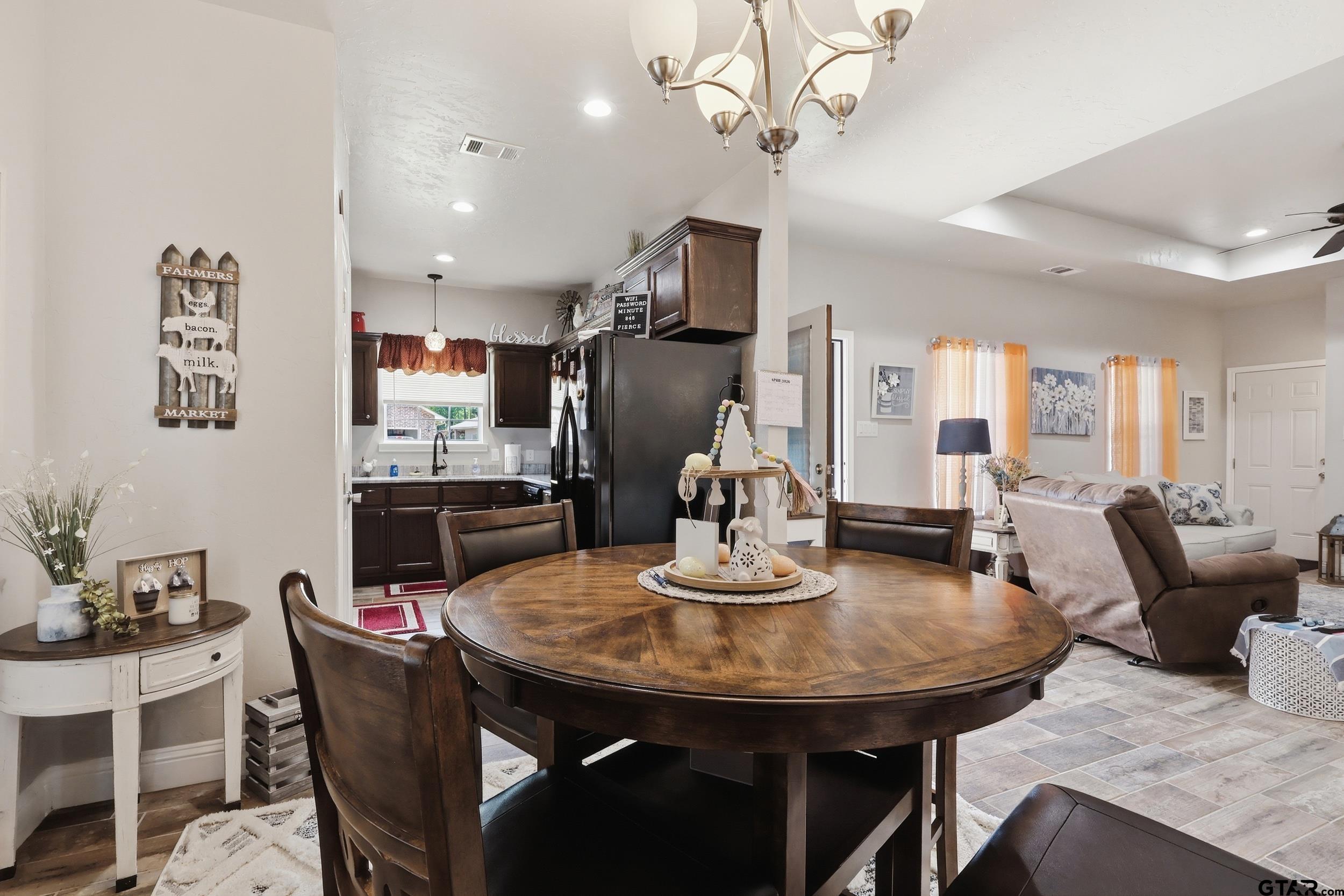 168 Tupelo Street Pittsburg, TX 75686 - Photo 9 of 28 a view of a dining room with furniture