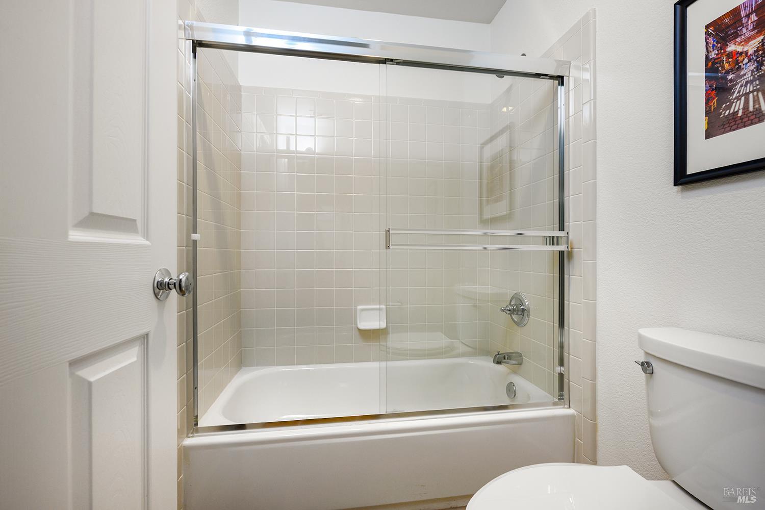38 Maybeck Street Novato, CA 94949 - Photo 42 of 47 a bathroom with a shower and a toilet