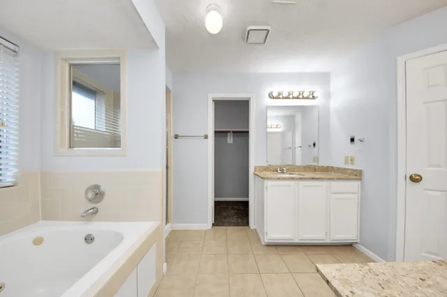 a bathroom with a bathtub sink and toilet