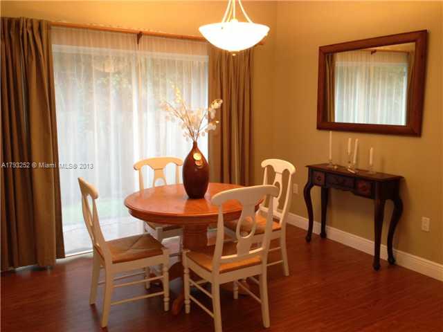 9216 Southwest 213th Lane Miami, FL 33189 - Photo 5 of 13 a dining room with furniture and window