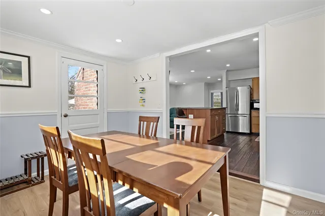 a view of a dining room with furniture and a livingroom