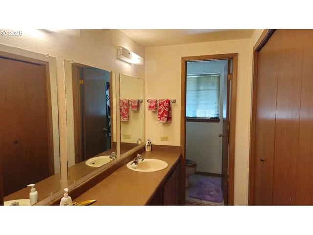 a bathroom with a sink double vanity and a mirror