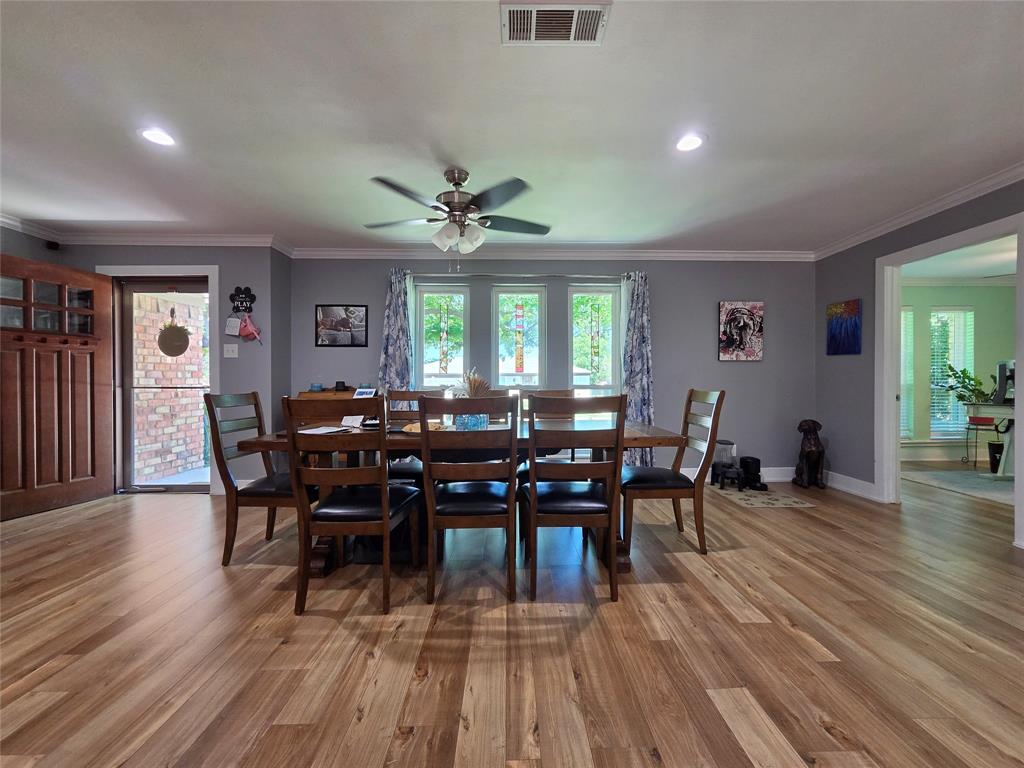 1023 Ridgefield Drive Plano, TX 75075 - Photo 5 of 39 a view of a dining room with furniture and wooden floor