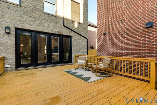 a bathroom with a sink vanity mirror and toilet