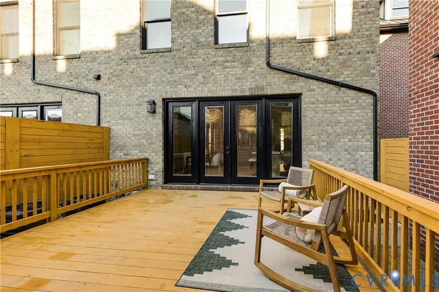 a bathroom with a sink a toilet a mirror a vanity and shower