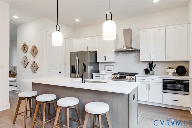 a bedroom with a white bed and white walls