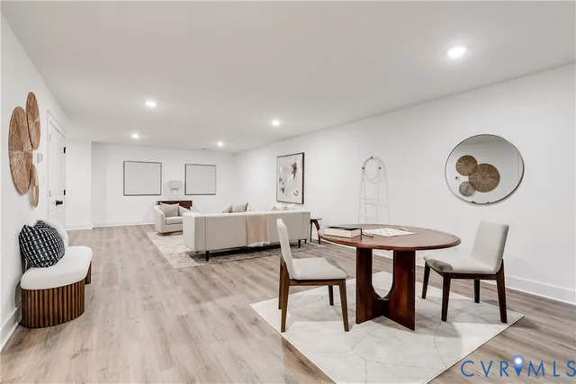 a bedroom with a bed a ceiling fan and a window