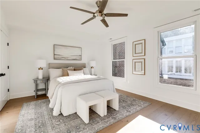 a bathroom with a double vanity sink mirror and shower
