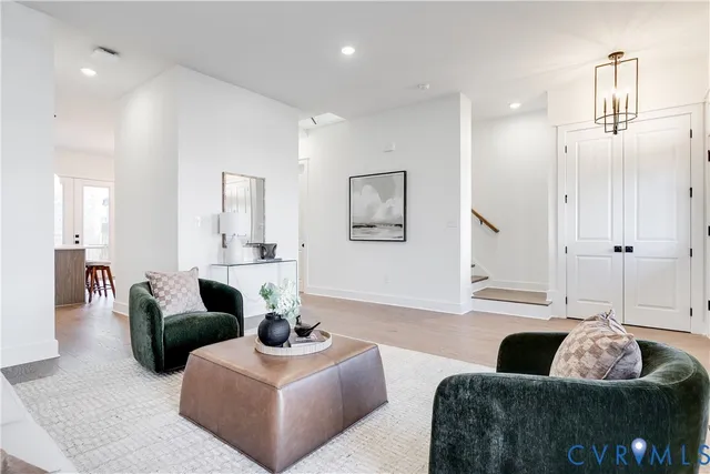 a kitchen with stainless steel appliances a sink a stove and a refrigerator