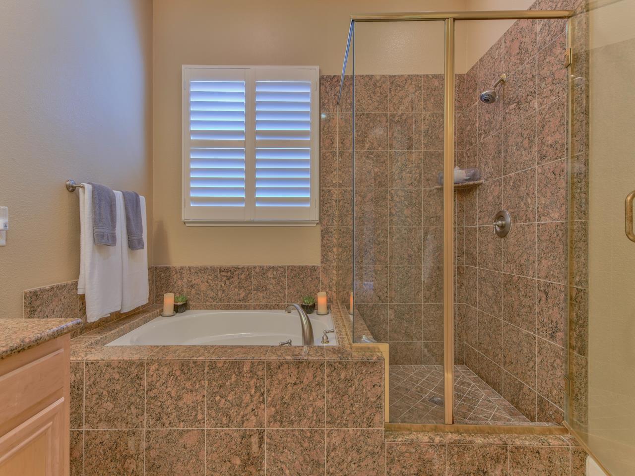 1975 Killarney Court Gilroy, CA 95020 - Photo 26 of 64 a bathroom with a granite countertop sink a toilet and shower