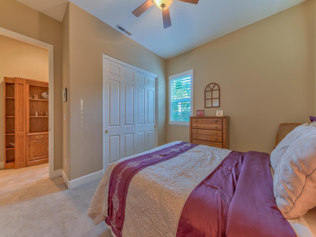 1975 Killarney Court Gilroy, CA 95020 - Photo 34 of 64 a bedroom with a bed and a chandelier