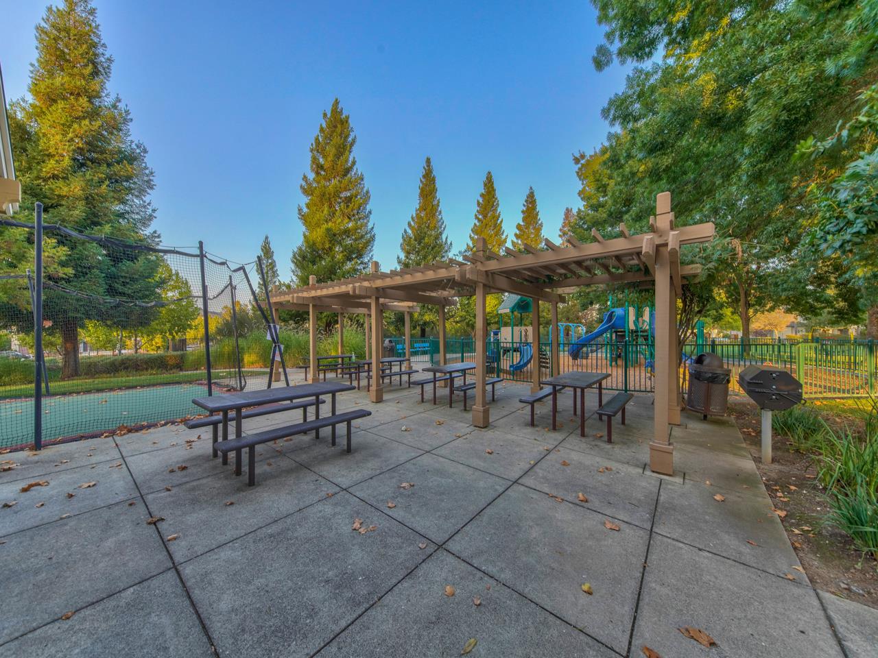 1975 Killarney Court Gilroy, CA 95020 - Photo 51 of 64 a view of a patio with a table and chairs under an umbrella with a garden