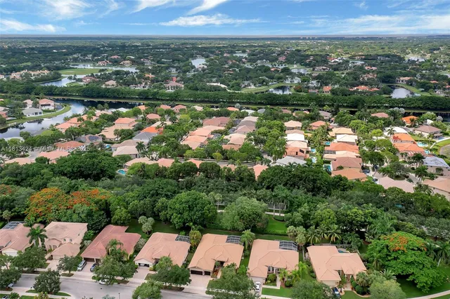 an aerial view of a house with a lake view