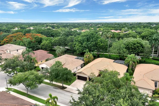 an aerial view of a house with garden space and outdoor space