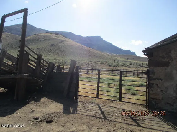 a view of a balcony with chairs and wooden floor