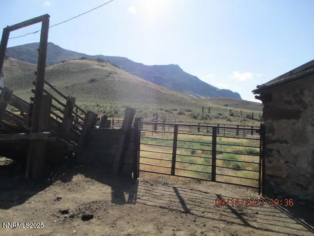 a view of a balcony with chairs and wooden floor