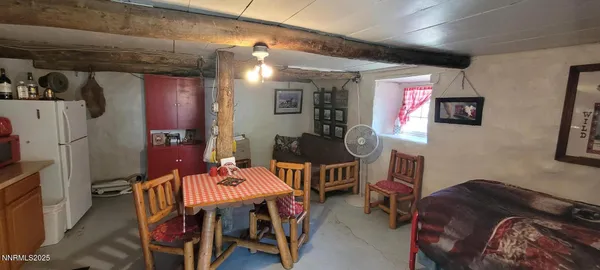 a dining room with furniture and wooden floor
