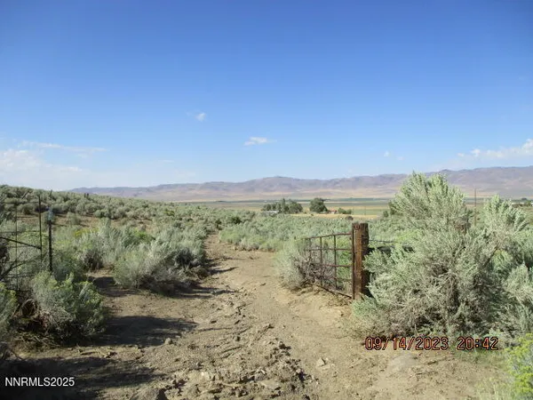 a view of a large mountains with a mountain in the background