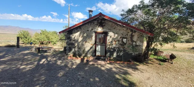 a view of a house with a tree