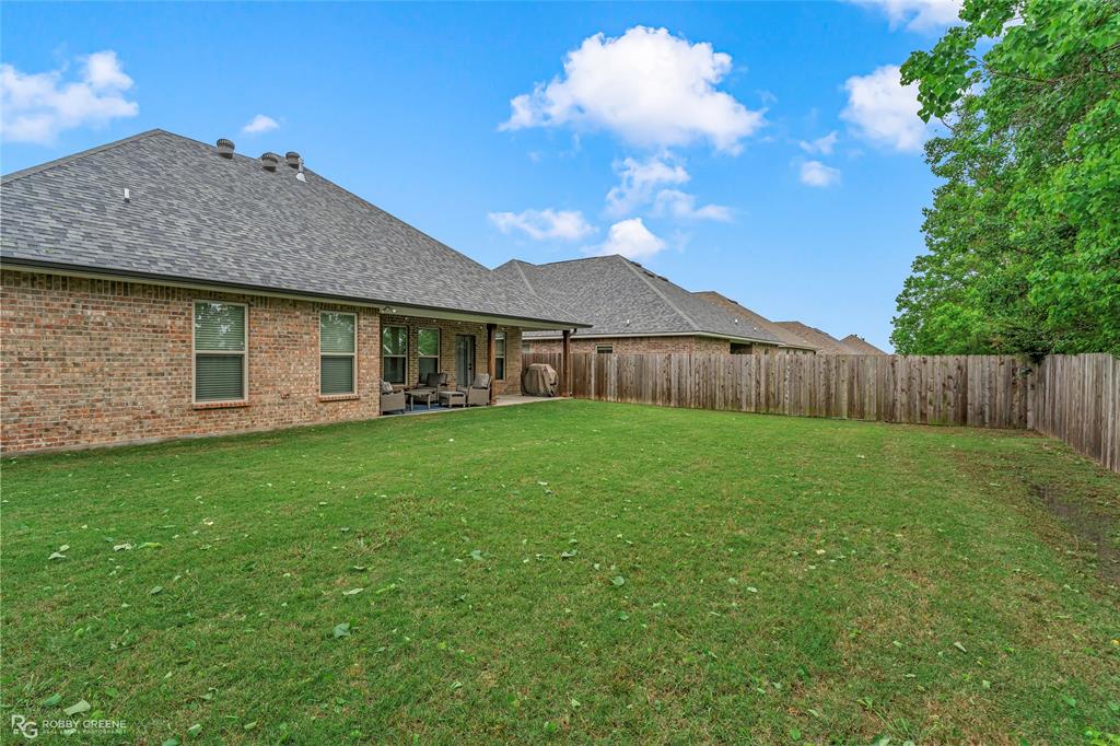 122 Brimestone Loop Benton, LA 71006 - Photo 29 of 33 a view of a house with a yard