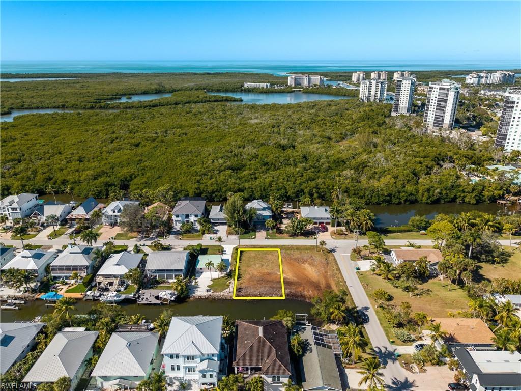 1292 Venetian Way Naples, FL 34110 - Photo 15 of 35 a view of a lake with a city