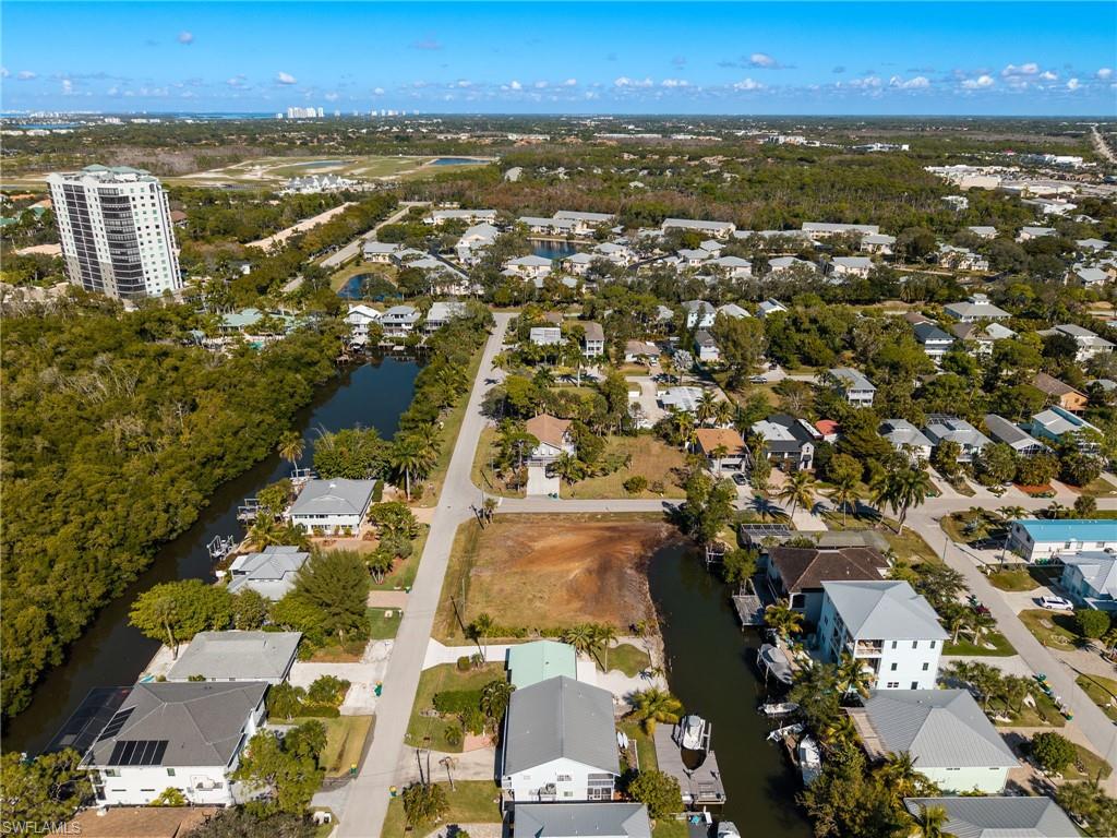 1292 Venetian Way Naples, FL 34110 - Photo 18 of 35 an aerial view of residential houses with outdoor space