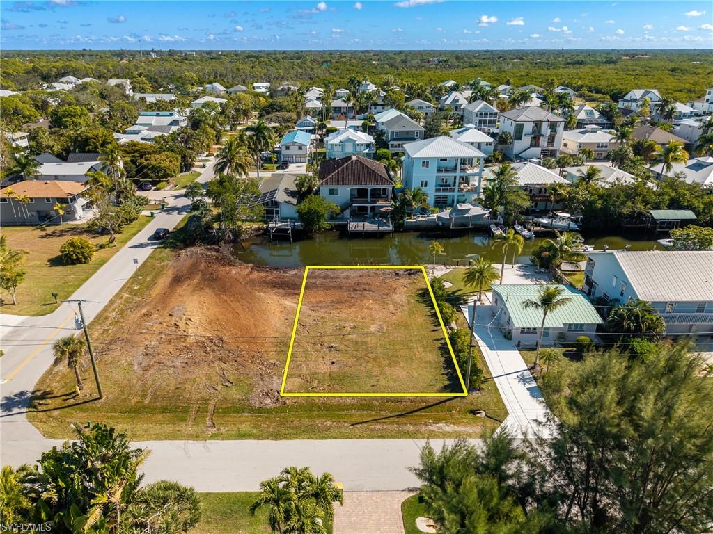 1292 Venetian Way Naples, FL 34110 - Photo 21 of 35 an aerial view of residential houses with outdoor space