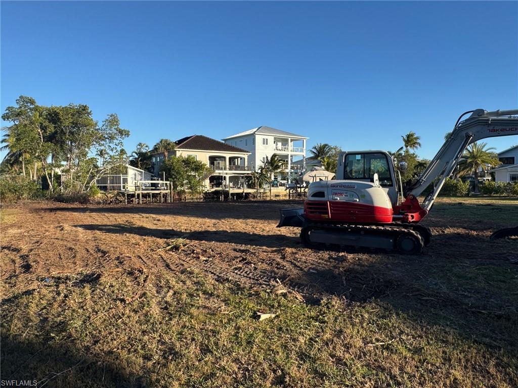 1292 Venetian Way Naples, FL 34110 - Photo 6 of 35 a buildings covered with tall trees