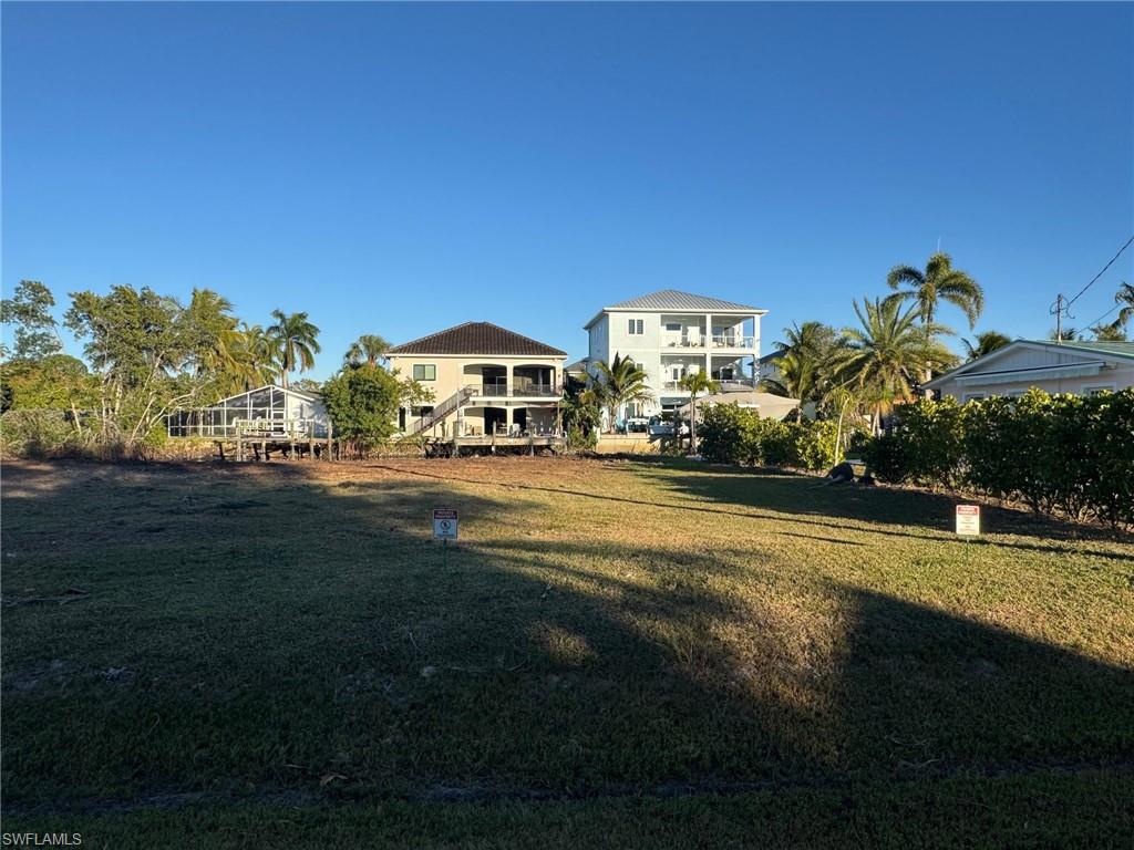 1292 Venetian Way Naples, FL 34110 - Photo 7 of 35 a view of a house with a yard