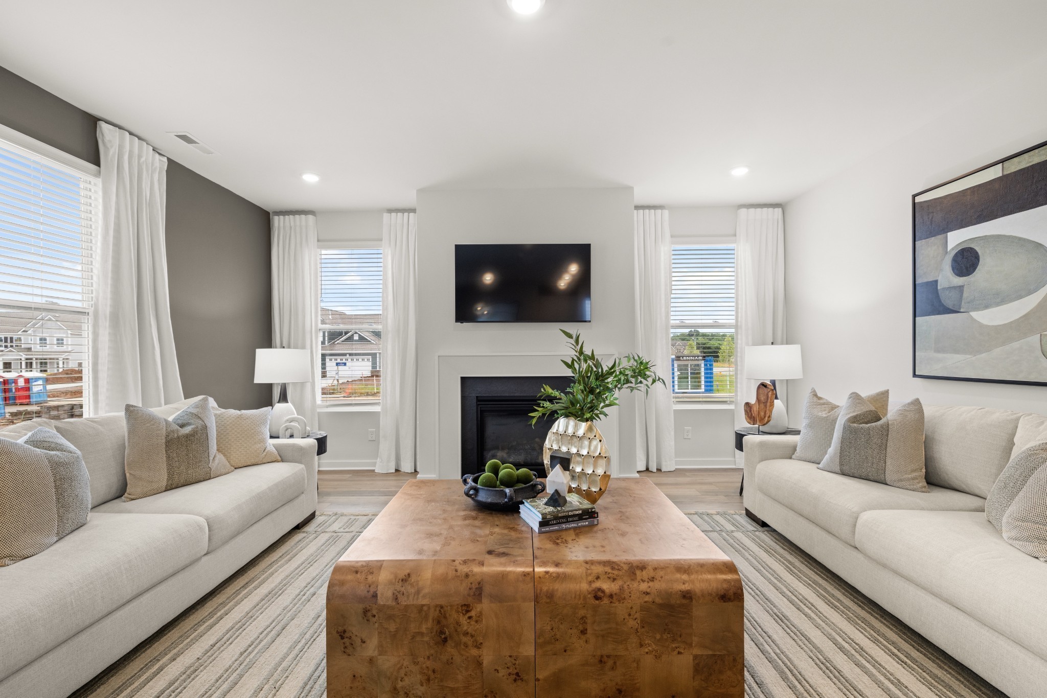 6370 North New Hope Road Hermitage, TN 37076 - Photo 24 of 84 a living room with furniture a fireplace and a flat screen tv