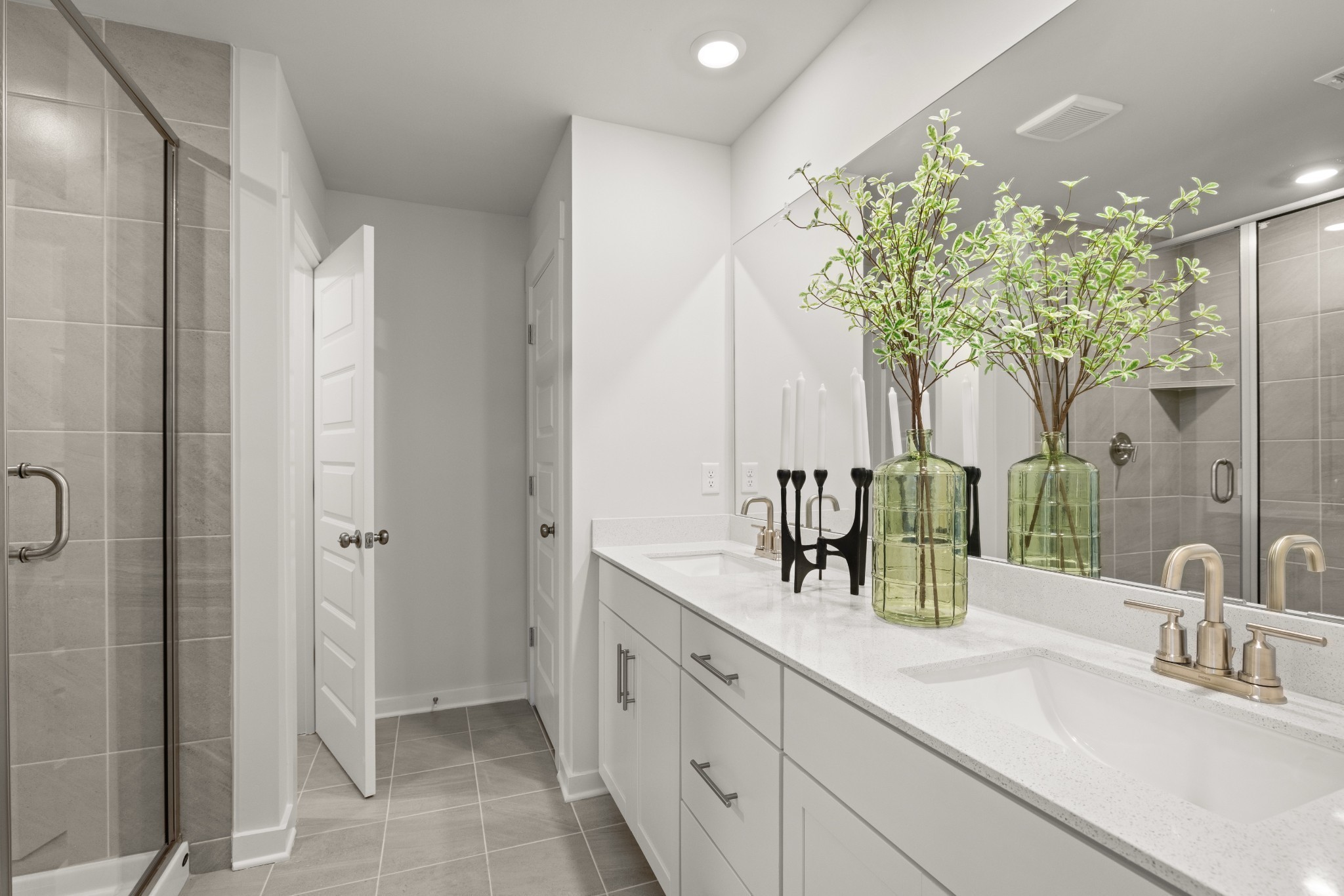 6370 North New Hope Road Hermitage, TN 37076 - Photo 50 of 84 a bathroom with a double vanity sink and a mirror