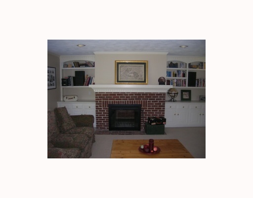 21 Hunter Ridge Drive Scituate, RI 02857 - Photo 3 of 4 Den/Family/Great Room. This spacious family room has a fireplace which is open on the living room side as well.
