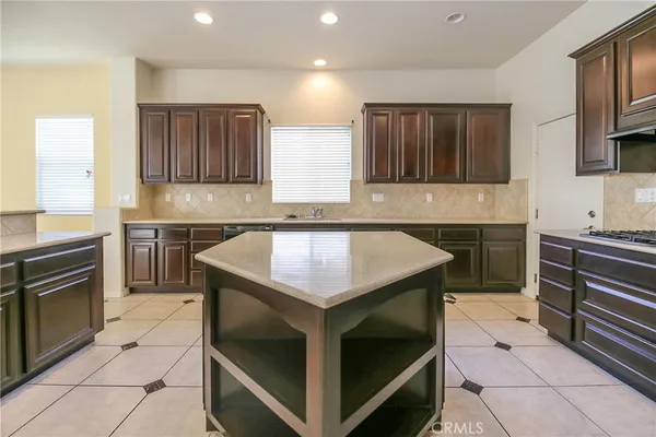 a kitchen with a stove and a sink